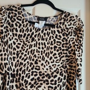 Cheetah print dress with ruffled hemline.